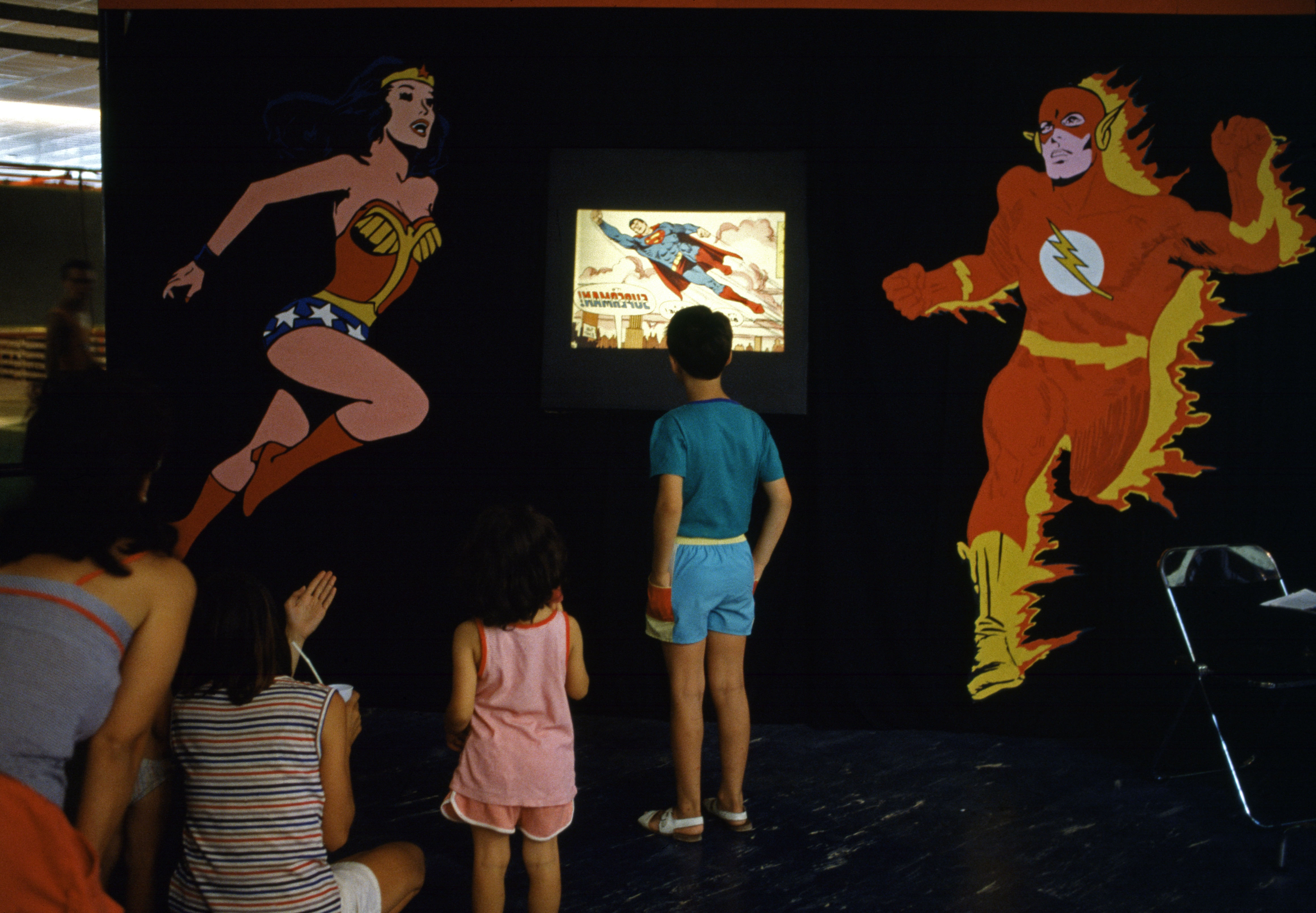 This scene was taken by Magnum photographer Ferdinando Scianna during a political meeting in Emilia-Romagna, Rimini, Italy, in 1985.